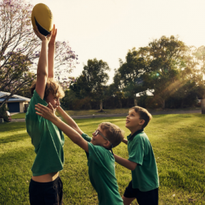 3 Boys Playing Football